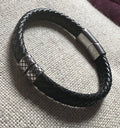 Bracelet in black, flat, braided leather with steel accents