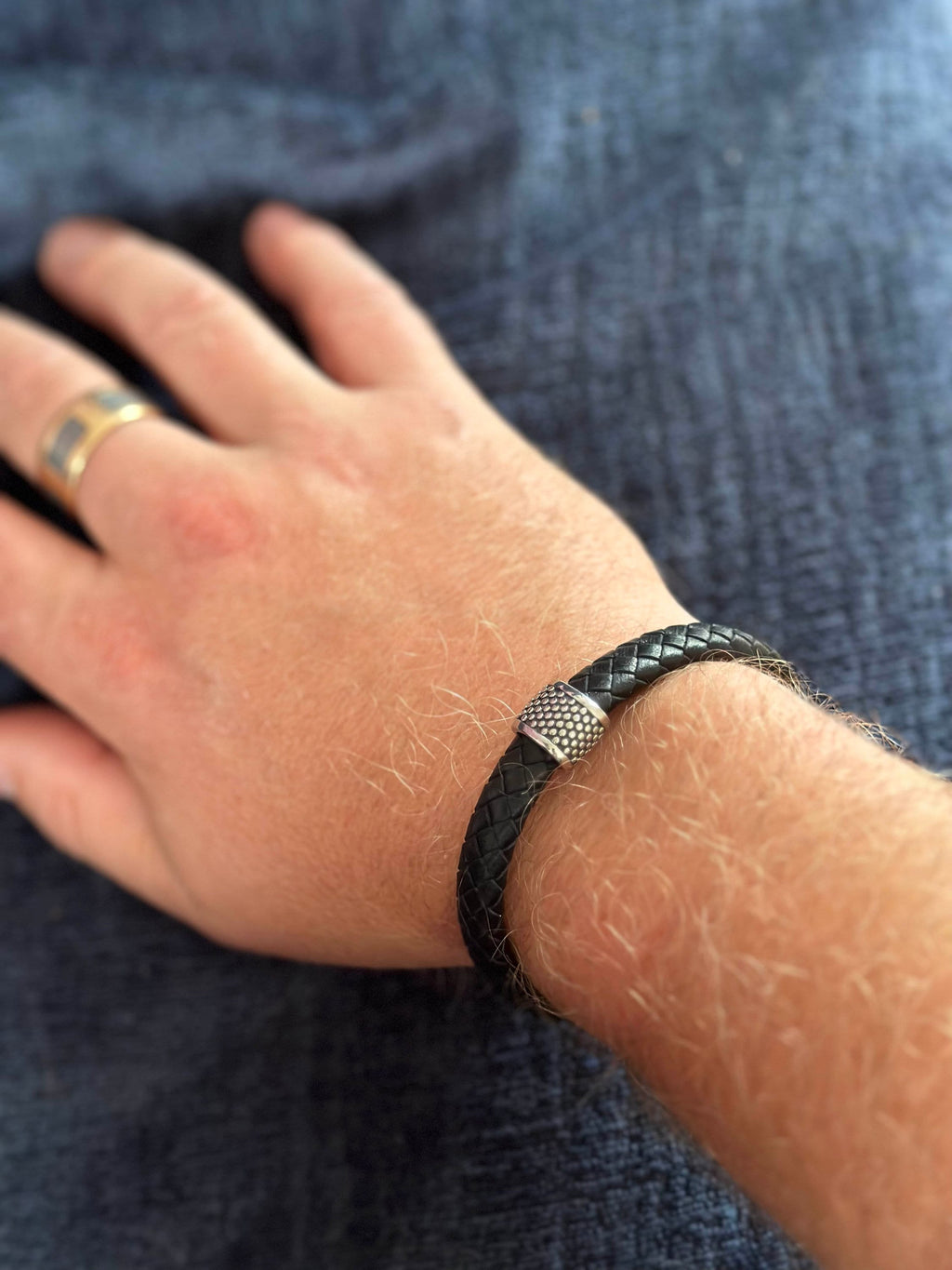 Mens leather braclet, flat braided in black with steel charm and magnetic lock